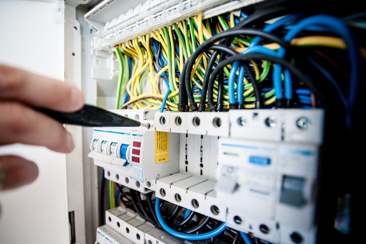 Close-up of an electrical panel and wiring during a service call